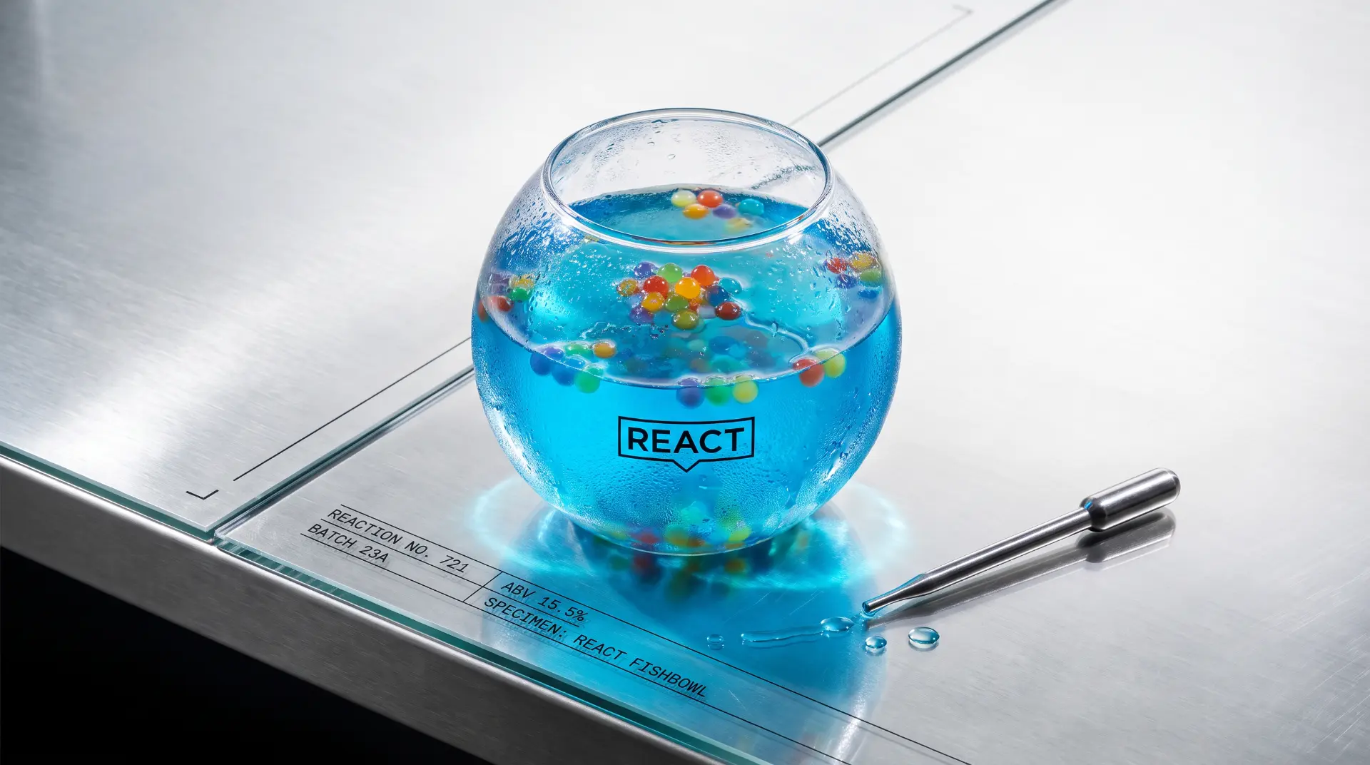 Open REACT Fishbowl on a stainless-steel development bench beside a laboratory pipette